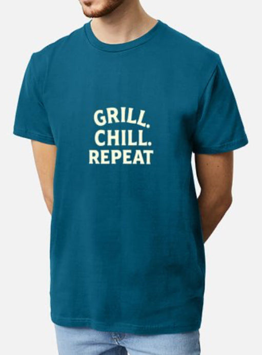 Person wearing a teal blue t-shirt with 'GRILL. CHILL. REPEAT' text on a white background