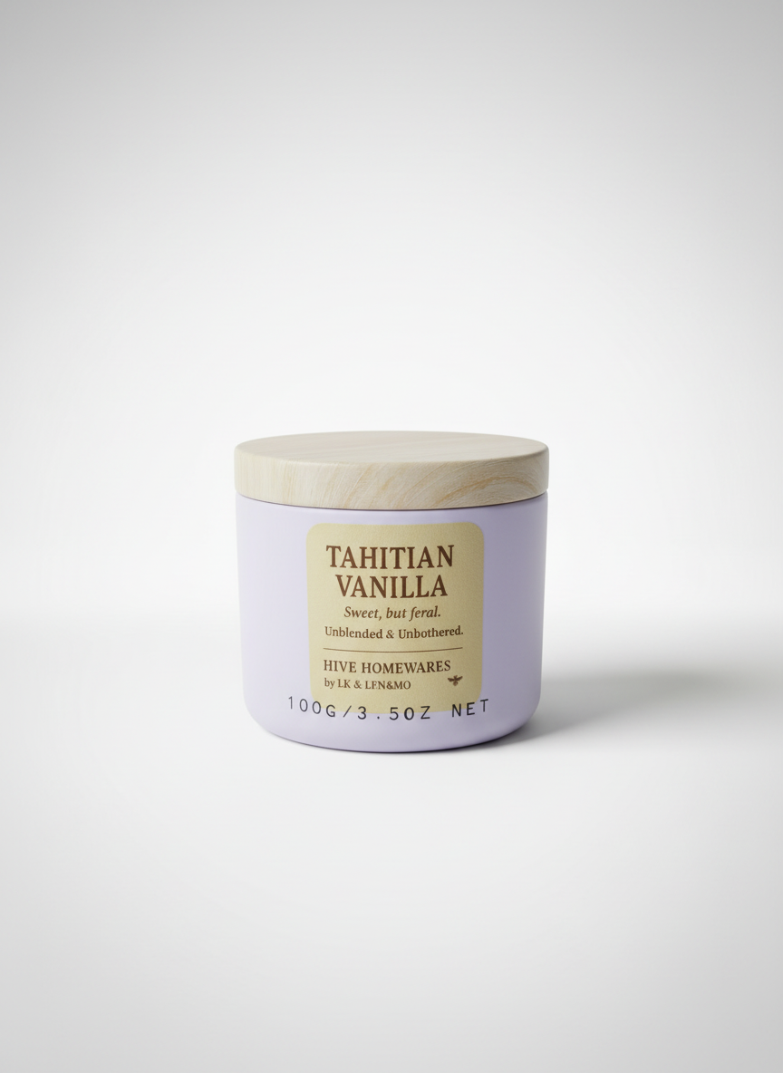 Tahitian Vanilla candle in a purple container on a white background