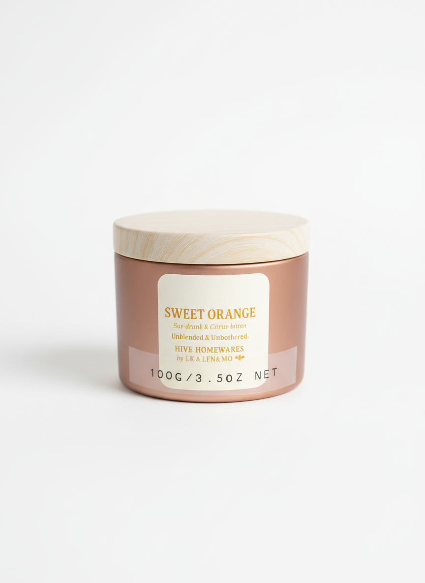 Jar of 'Sweet Orange' candle on a white background