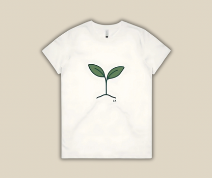 White t-shirt with a green plant design on a beige background