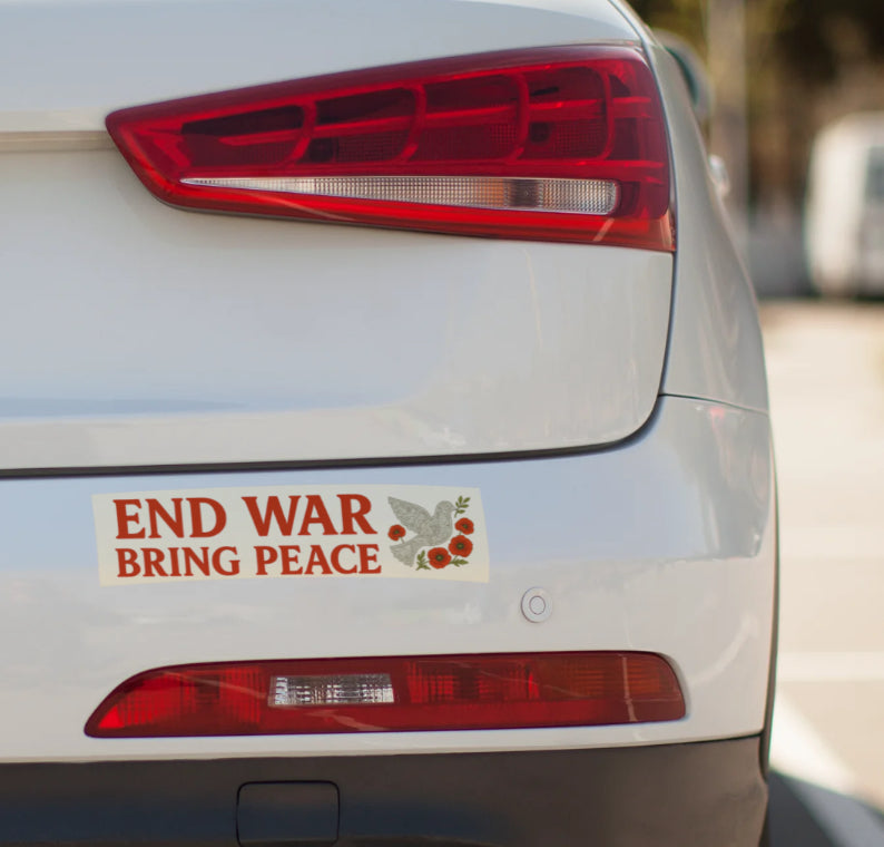 Car with a 'End War Bring Peace' sticker on the back