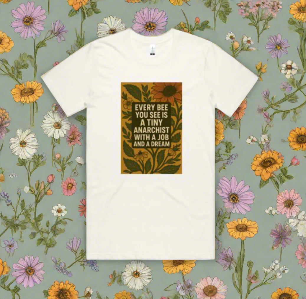 White t-shirt with a graphic design featuring text and leaves on a white background