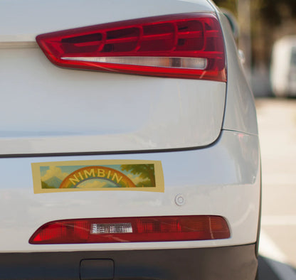 Car tail light with a 'Nimbin' sticker on a white car
