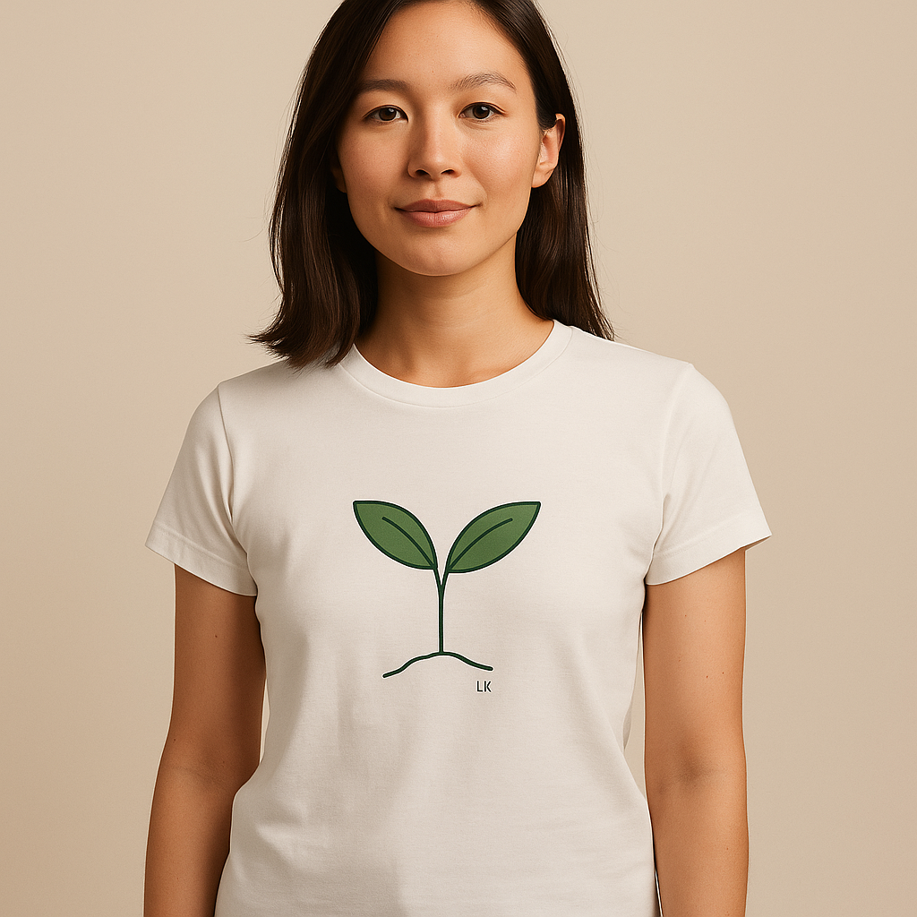 Person wearing a white t-shirt with a green plant design on a beige background