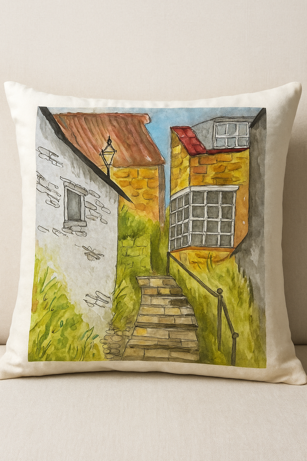 Decorative pillow with a painting of a quaint street scene on a beige background