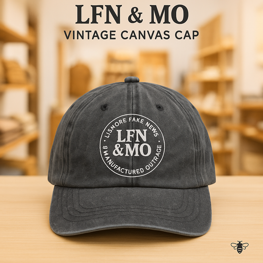 Vintage-style black faded cap featuring the LFN&MO logo in retro lettering. Soft worn look with curved brim, designed by Hive Homewares for lovers of local satire and mystery.