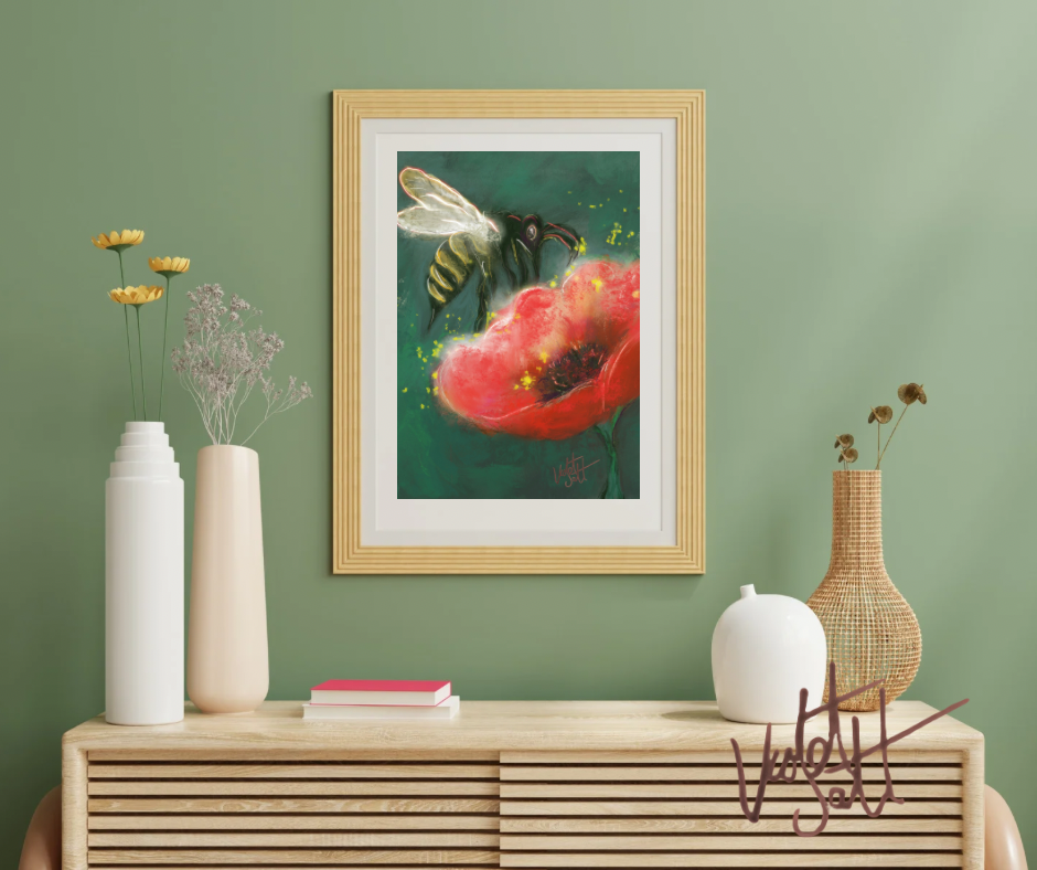 Framed artwork of a bee on a flower above a wooden console table with decorative items.
