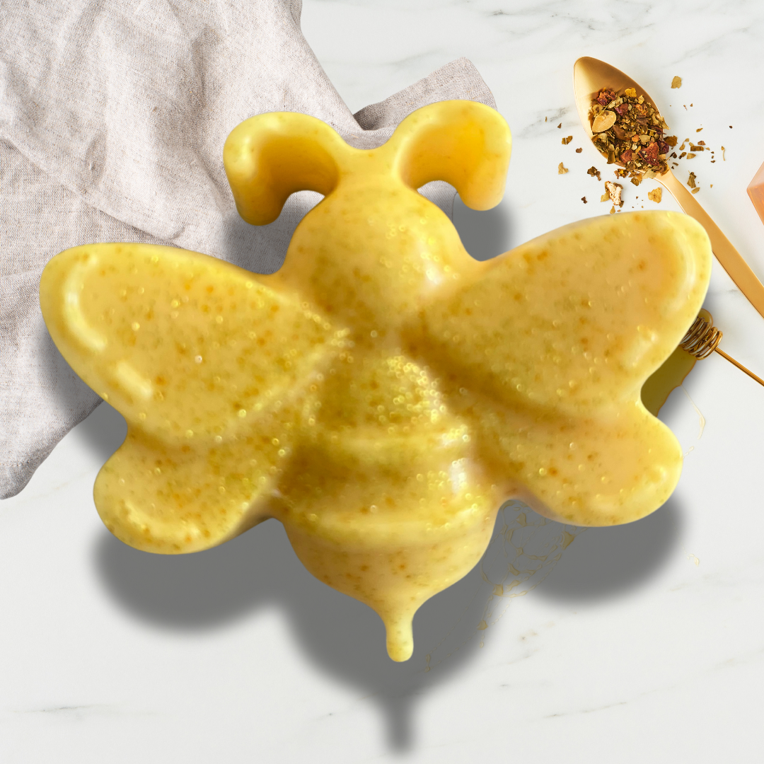 Yellow bee-shaped soap on a light background