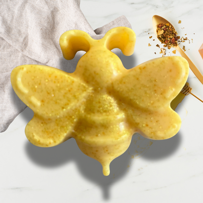 Yellow bee-shaped soap on a light background