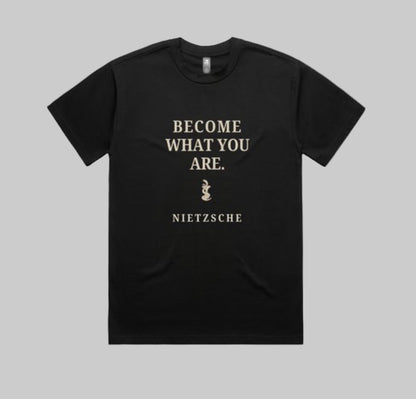 Black t-shirt with white text 'BECOME WHAT YOU ARE. NIETZSCHE' on a white background