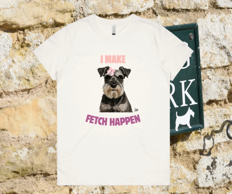 White t-shirt with a schnauzer dog graphic and text on a stone wall background
