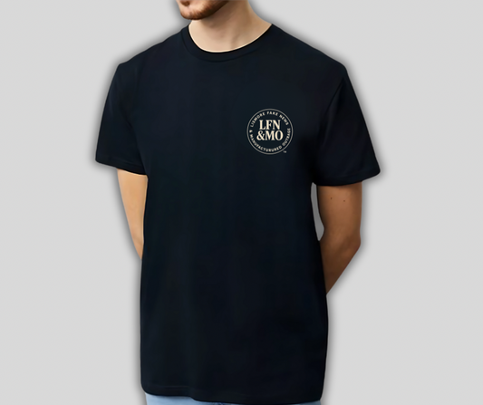 Person wearing a black t-shirt with a logo on a gray background