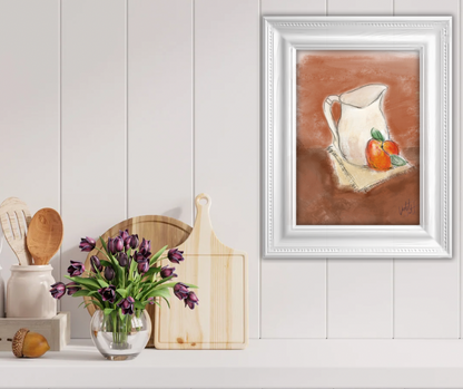 Framed artwork of a pitcher and apples on a table, with a vase of purple tulips and wooden cutting board below.