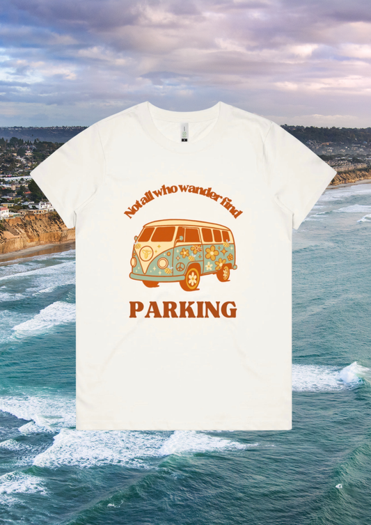 White t-shirt with a van graphic and text on a scenic background